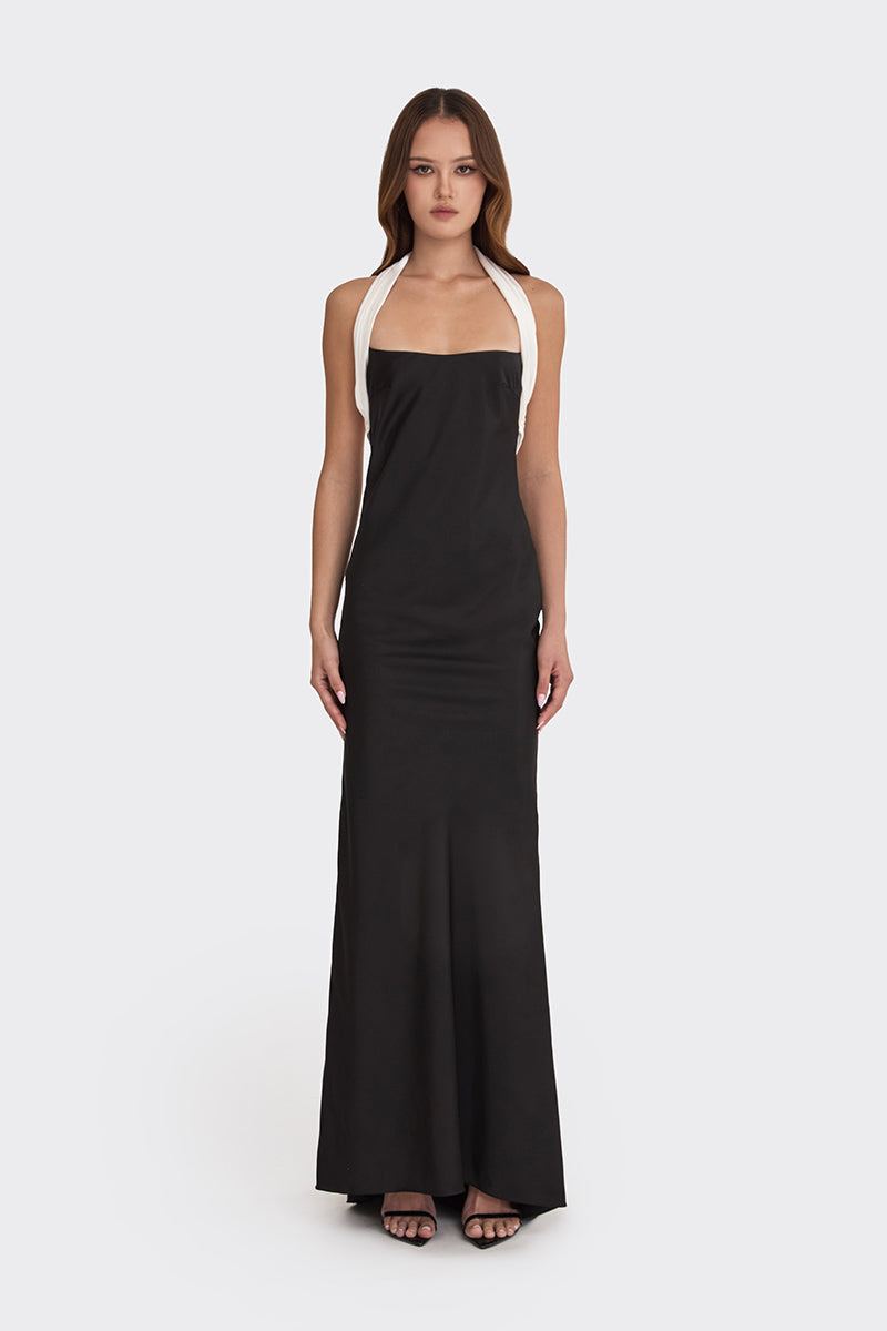 Black Angeline maxi dress by Stolen Stores, flowing fabric and elegant design, shown on a model.