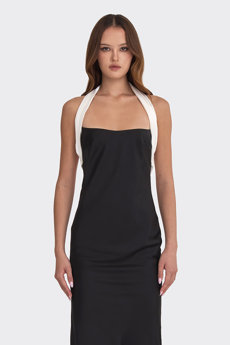 Black Angeline maxi dress by Stolen Stores, flowing fabric with a stylish, elegant silhouette perfect for summer or formal occasions.