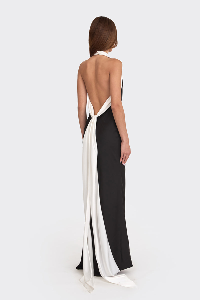 Black Angeline maxi dress by Stolen Stores, featuring flowing fabric and elegant design, shown on a model.
