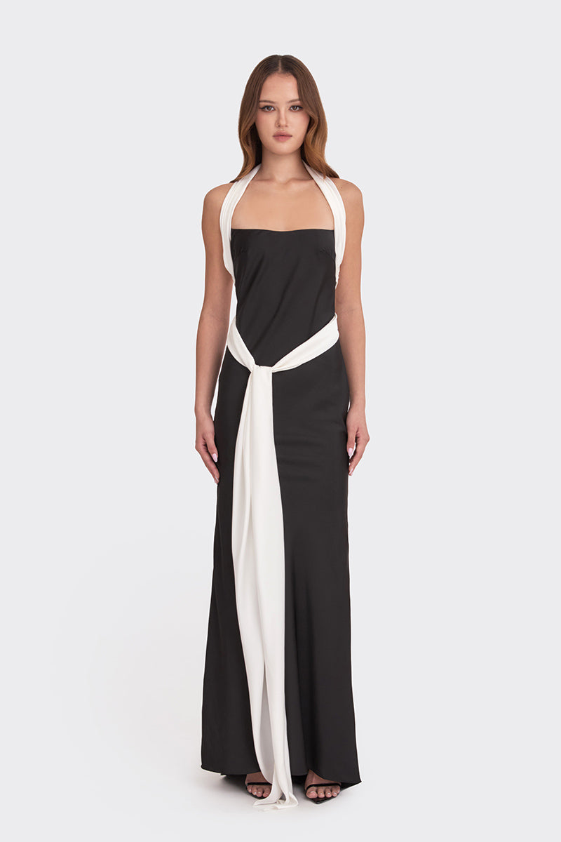 Black Angeline maxi dress by Stolen Stores, flowing fabric and elegant design, displayed on a model.
