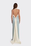 Stolen Stores Angeline Maxi Dress in dusty blue displayed on a hanger, featuring a flowing silhouette and elegant design.