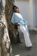 Light blue ANI BLOUSE by ANA + MARIA, a stylish women's tops blouse with a relaxed fit and elegant design.