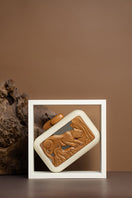 Off-white acrylic clutch bag featuring animal print design from Sy&Vie's Animalis Onça collection.