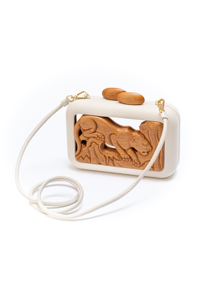 Off-white Animalis Onça mirror clutch by Sy&Vie featuring a sleek animal print design and compact style for elegant occasions.