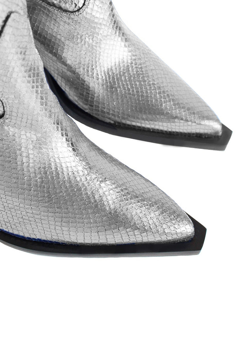 Silver Annie cowboy boots by Terry de Havilland featuring pointed toes and decorative stitching, shown from the front view.