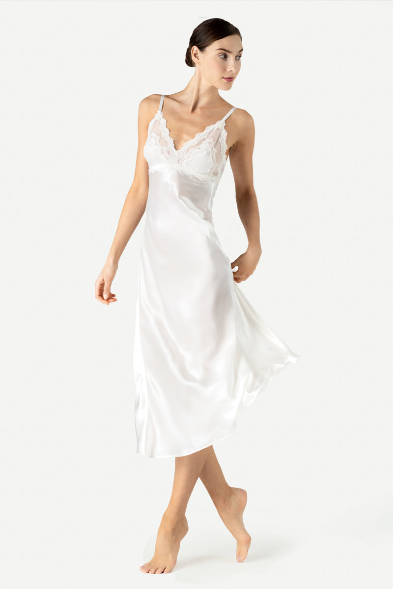 Anya NK IMODE ivory long silk nightgown with bust-support, shown from the side view, elegant and flowing for comfortable sleep.