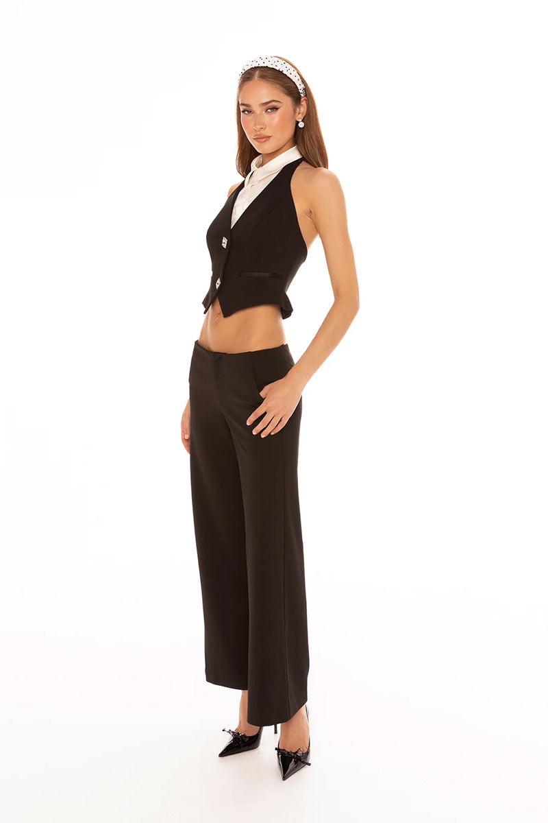 Black Nana Jacqueline Anya pants shown on a model, featuring a tailored fit and stylish design.