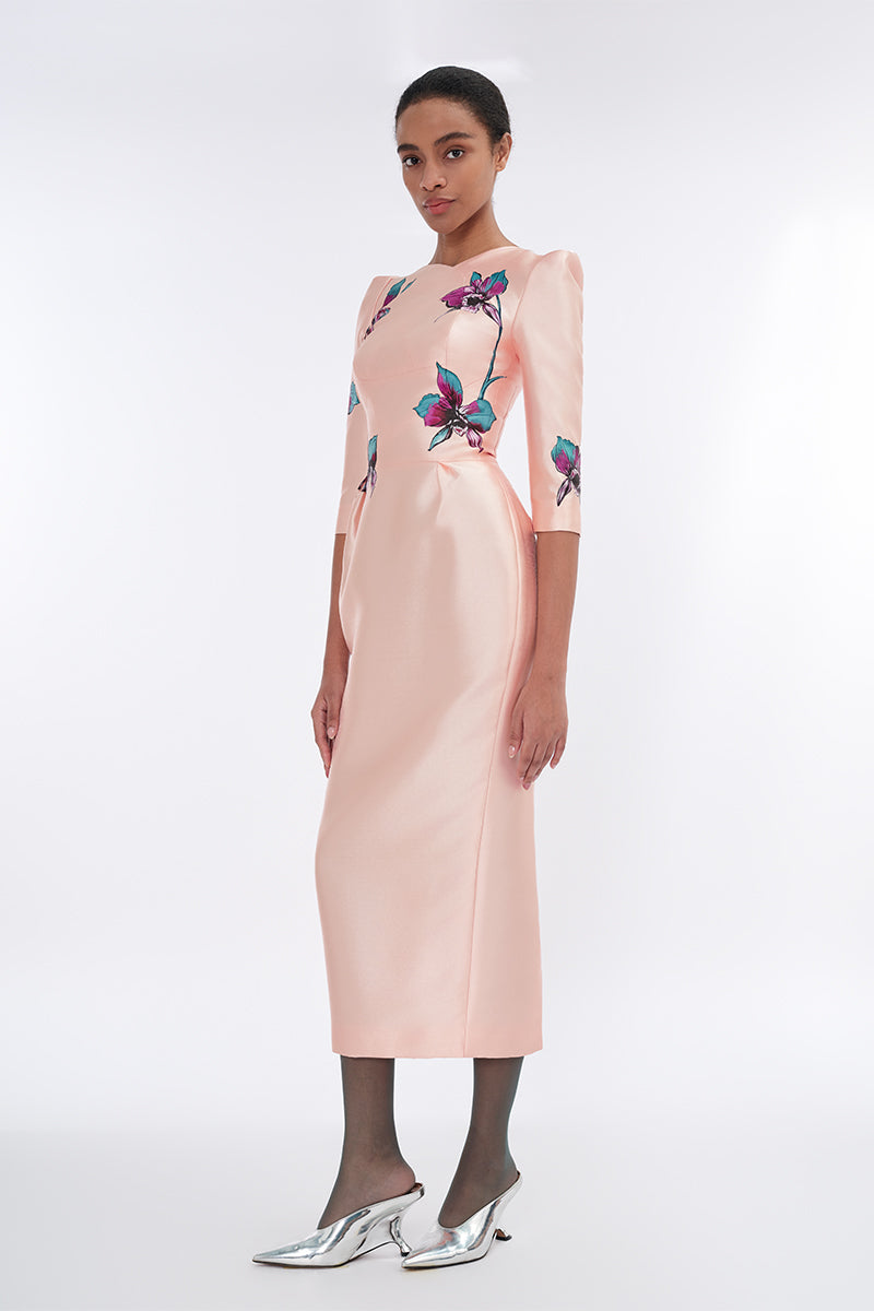 Apricot blush sculpted V-neck pegged midi dress by Tiny Ink, featuring a fitted waist and elegant design, shown on a model.