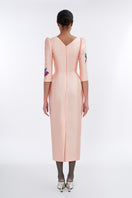 Apricot blush sculpted V-neck pegged midi dress by Tiny Ink, featuring a fitted waist and elegant design.