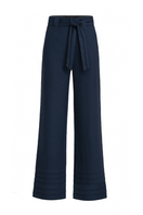 Navy blue ANA + MARIA Ara pants displayed on a mannequin, showcasing their stylish fit and fabric texture.
