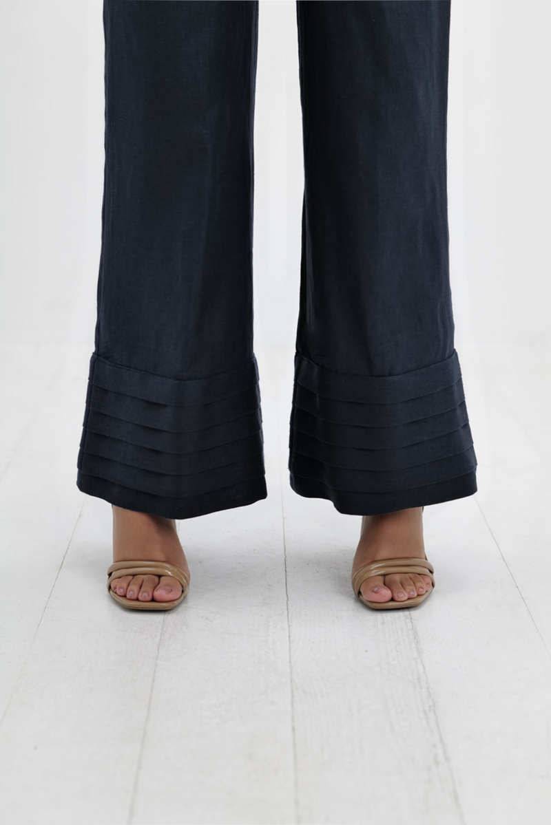 Navy blue Ara pants by Ana + Maria displayed on a model, showcasing their tailored fit and stylish design.