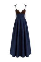 Maylé Vásquez brown and navy Arena gown featuring elegant fabric and stylish design, perfect for formal occasions.