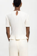 Off-white ARENA T-shirt top by Maylé Vásquez featuring a casual, stylish shirt design with a comfortable fit.