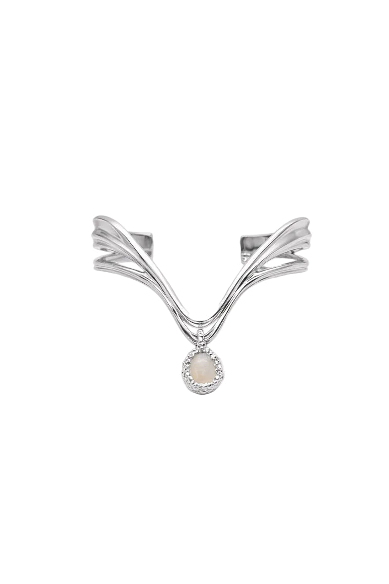 Silver and white drape bracelet by Jude Benhalim featuring elegant, flowing design with textured silver accents.