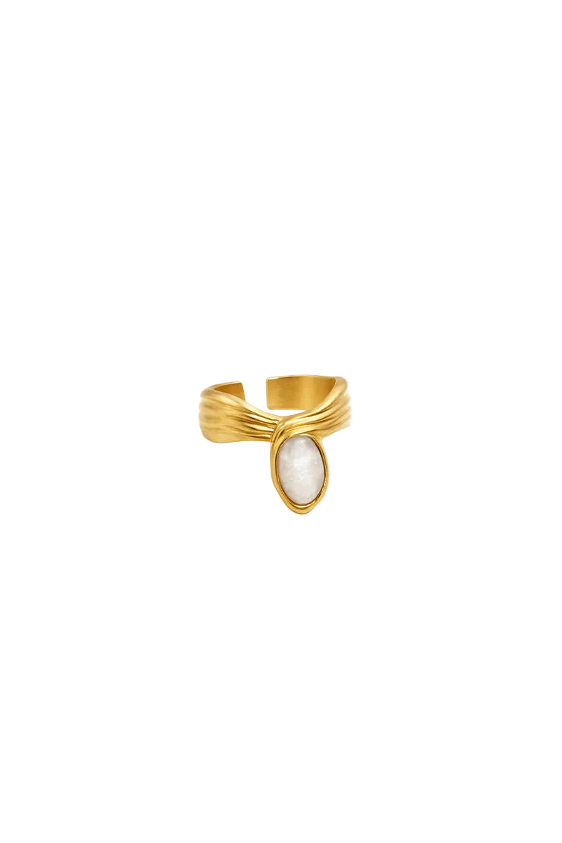 Gold and white anchor ring by Jude Benhalim, featuring a sleek design and polished finish on a plain background.