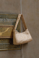 VERDI Arista seashell shoulder bag in gold with textured shell design and elegant strap, perfect for stylish accessories.