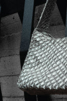 Silver Arista seashell shoulder bag by VERDI, featuring a stylish seashell design and adjustable shoulder strap.