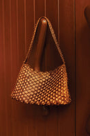 Verdi Arista seashell shoulder bag in copper with textured seashell design and adjustable strap.