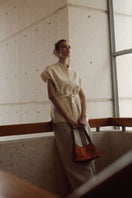 Verdi Arista seashell copper shoulder bag featuring textured seashell design and adjustable strap for stylish carry.