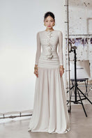 Do Long Cult Mia X Do Long sculpted Grace maxi dress displayed on a hanger, featuring a fitted silhouette and elegant design.