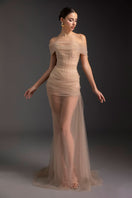 Le Thanh Hoa Blazing Desire gown featuring elegant fabric, intricate details, and a flowing silhouette for formal occasions.