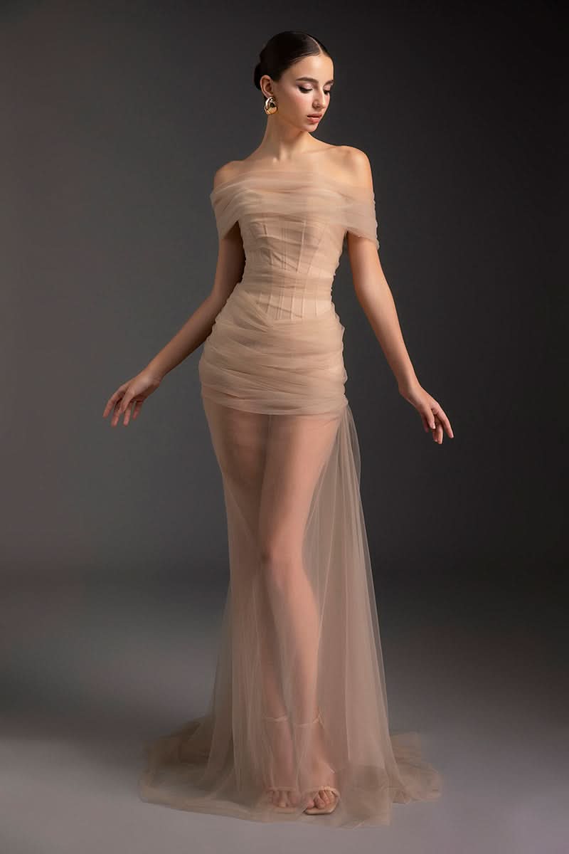Le Thanh Hoa Blazing Desire gown featuring elegant fabric, intricate details, and a flowing silhouette for formal occasions.