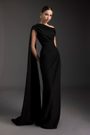 Le Thanh Hoa Midnight Serenade gown, elegant evening dress with flowing fabric and subtle detailing, displayed on a mannequin.
