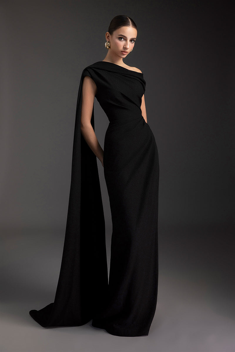 Le Thanh Hoa Midnight Serenade gown, elegant evening dress with flowing fabric and subtle detailing, displayed on a mannequin.