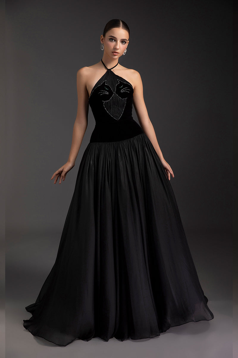 Le Thanh Hoa obsidian charm A-line gown with flowing fabric and elegant design, displayed on a dress form.