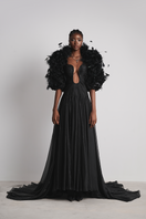 Elegant black Celestial Whisper gown by Le Thanh Hoa featuring flowing fabric and intricate detailing.