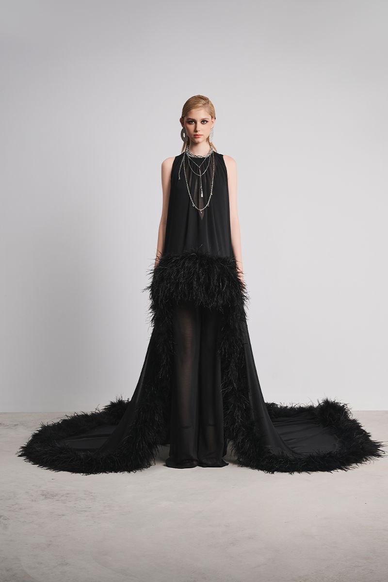 Black Nocturnal Warmth jumpsuit by Le Thanh Hoa, featuring a sleek, stylish design with a fitted silhouette and modern details.