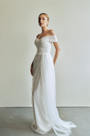 Le Thanh Hoa Sophia Simply White long gown with flowing fabric and elegant design, perfect for formal occasions.