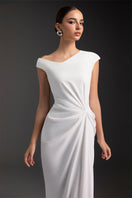 Elegant luminous pearl gown by Le Thanh Hoa featuring intricate detailing and a flowing silhouette.