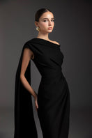 Le Thanh Hoa Midnight Serenade gown featuring elegant dark fabric, flowing design, and intricate details for formal occasions.