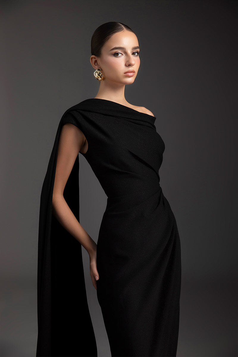 Le Thanh Hoa Midnight Serenade gown featuring elegant dark fabric, flowing design, and intricate details for formal occasions.