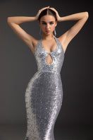 Le Thanh Hoa shimmering goddess gown featuring flowing fabric and intricate detailing, perfect for elegant evening wear.