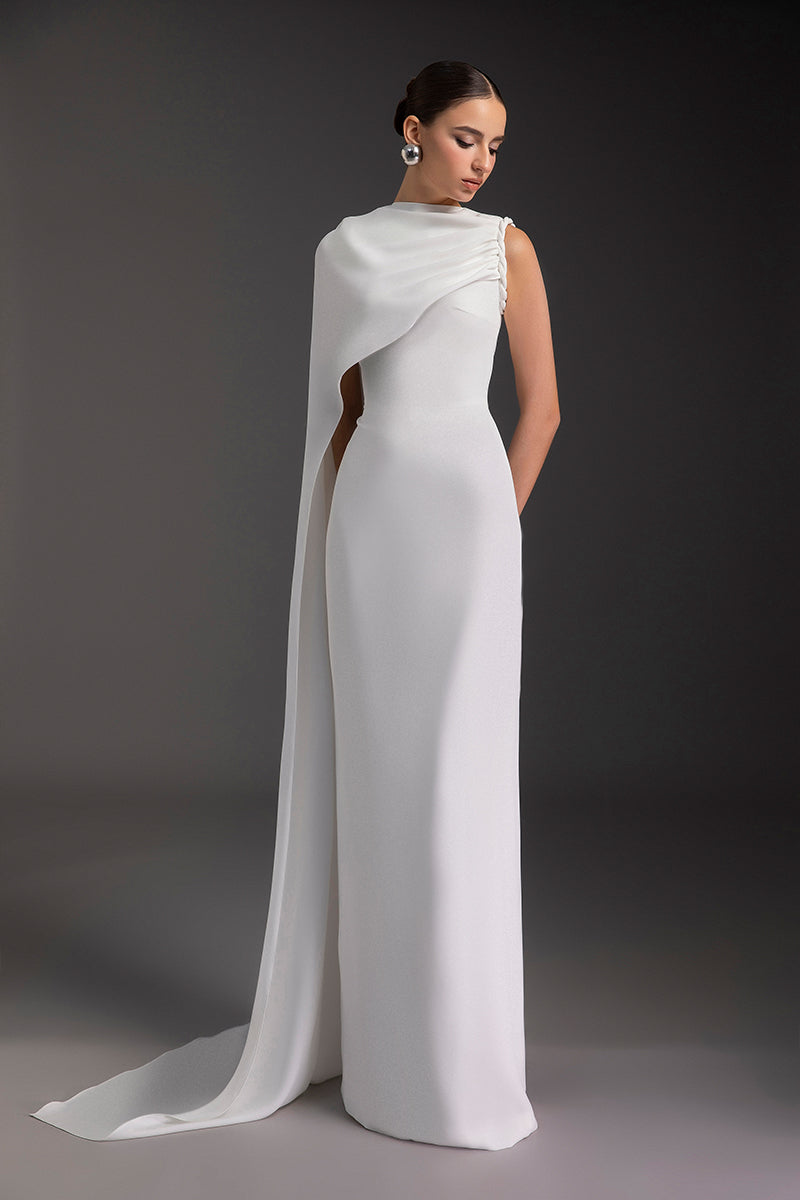 Elegant PURE ESSENCE GOWN by Le Thanh Hoa featuring flowing fabric and intricate design, perfect for formal occasions.