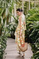 Do Long LUSH EDEN maxi dress shown hanging, featuring a flowy fabric, floral pattern, and sleeveless design for elegant summer wear.