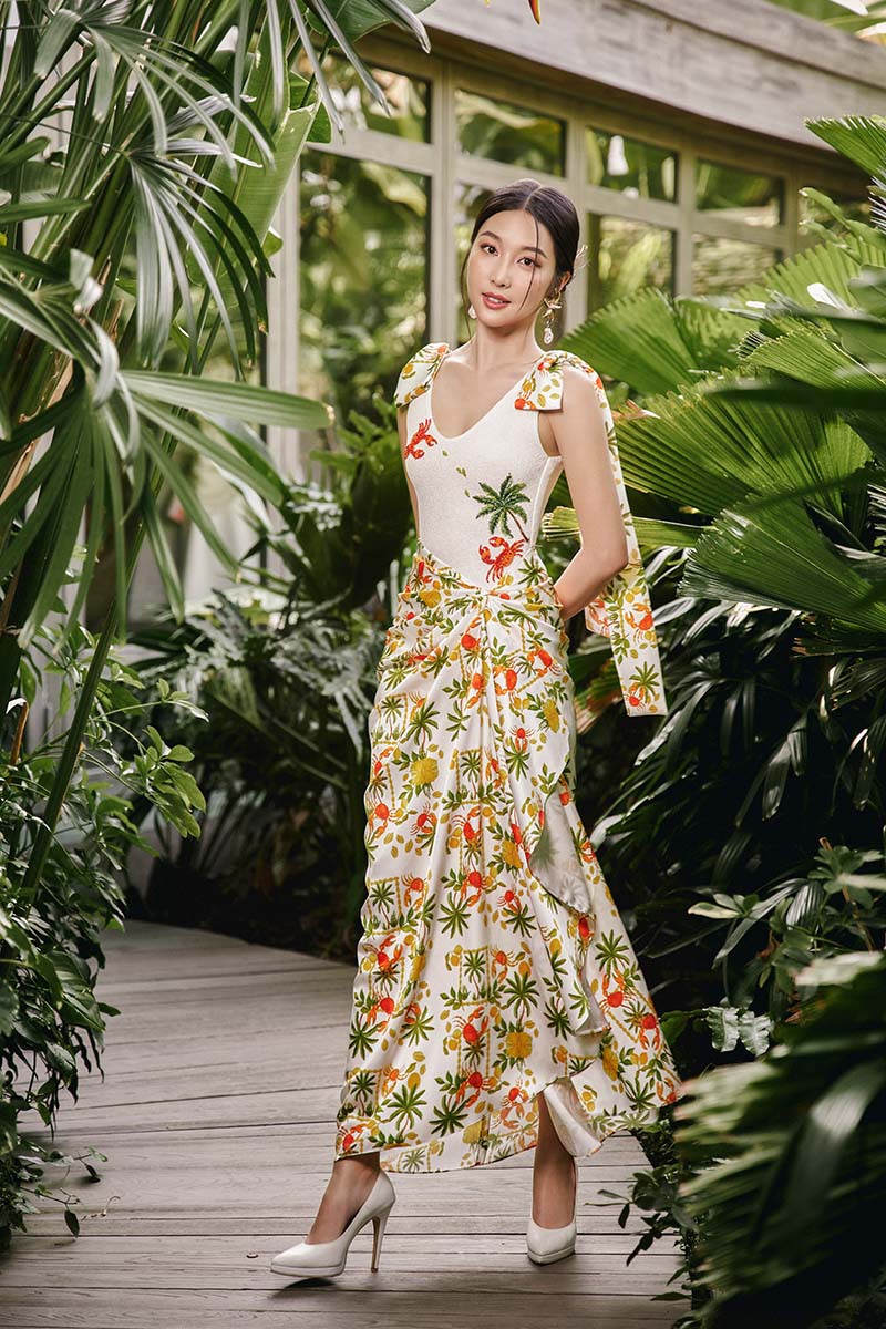 Do Long LUSH EDEN Maxi Dress featuring a flowing fabric and floral pattern, displayed on a hanger against a neutral background.