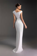 Le Thanh Hoa luminous pearl gown featuring intricate embroidery and flowing fabric, perfect for elegant occasions.