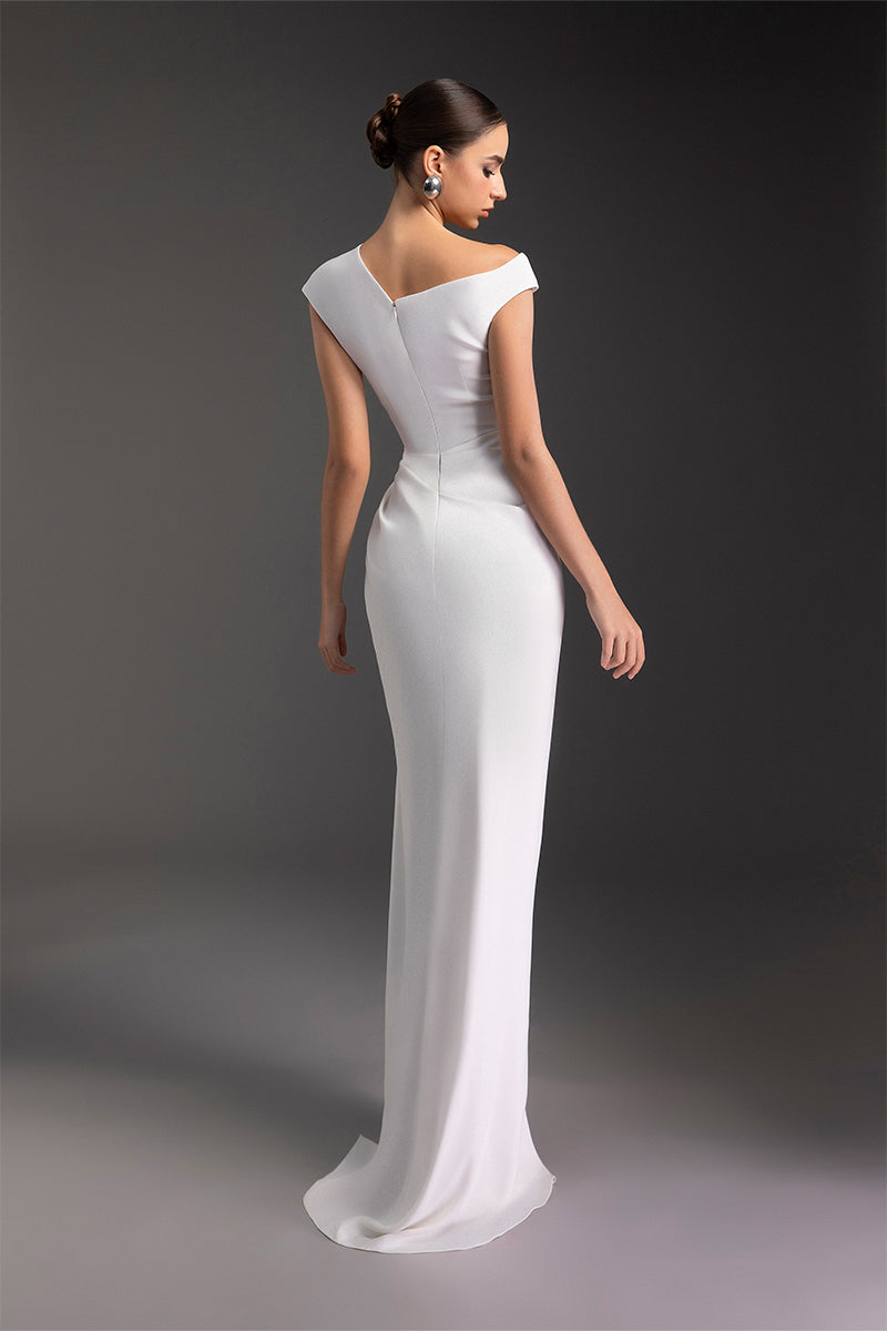 Le Thanh Hoa luminous pearl gown featuring intricate embroidery and flowing fabric, perfect for elegant occasions.