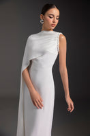 Elegant PURE ESSENCE gown by Le Thanh Hoa featuring flowing fabric and intricate details, perfect for formal occasions.