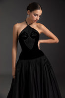 Le Thanh Hoa obsidian charm A-line gown featuring flowing fabric and elegant design, perfect for formal occasions.