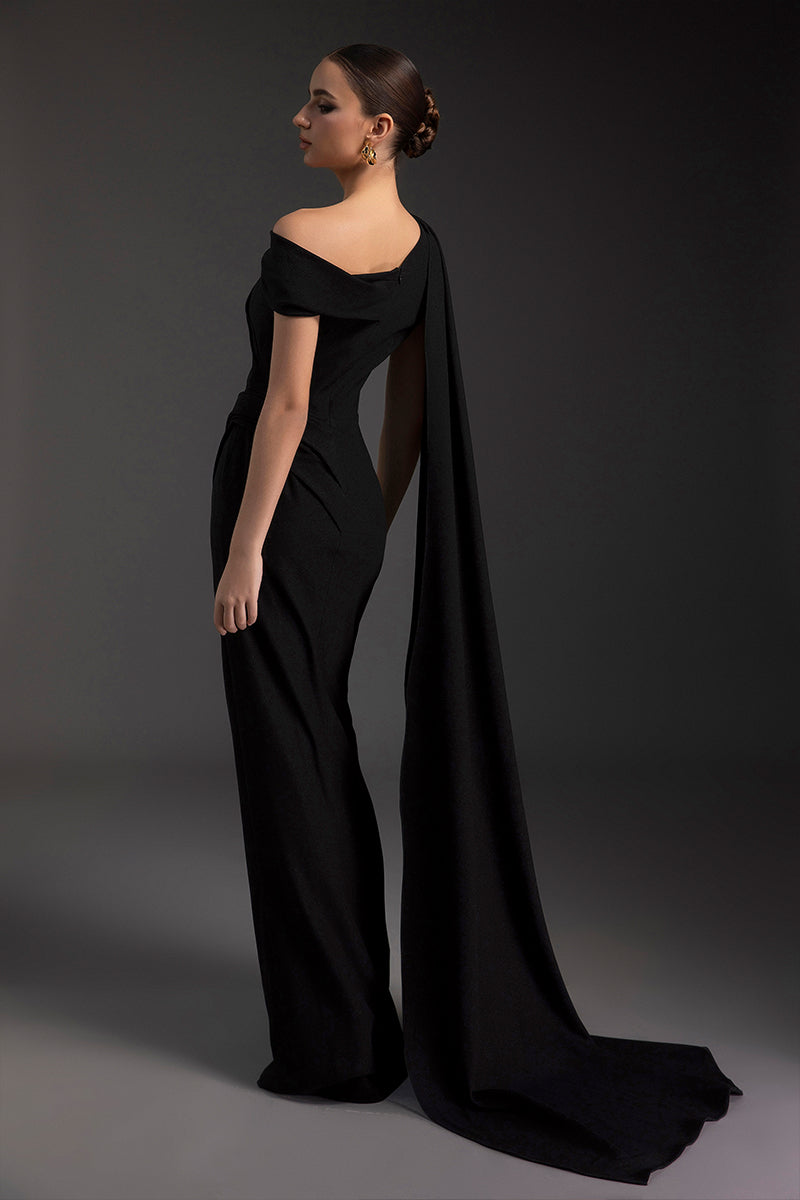 Elegant midnight blue gown by Le Thanh Hoa featuring flowing fabric and intricate embroidery, perfect for formal occasions.