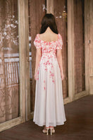 Floral Mirage maxi dress by Do Long featuring a flowy silhouette and vibrant floral patterns, perfect for summer occasions.