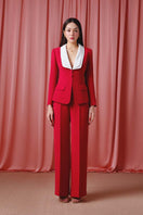Do Long crimson power suit set co-ords featuring a tailored blazer and matching pants, styled for a chic, modern look.