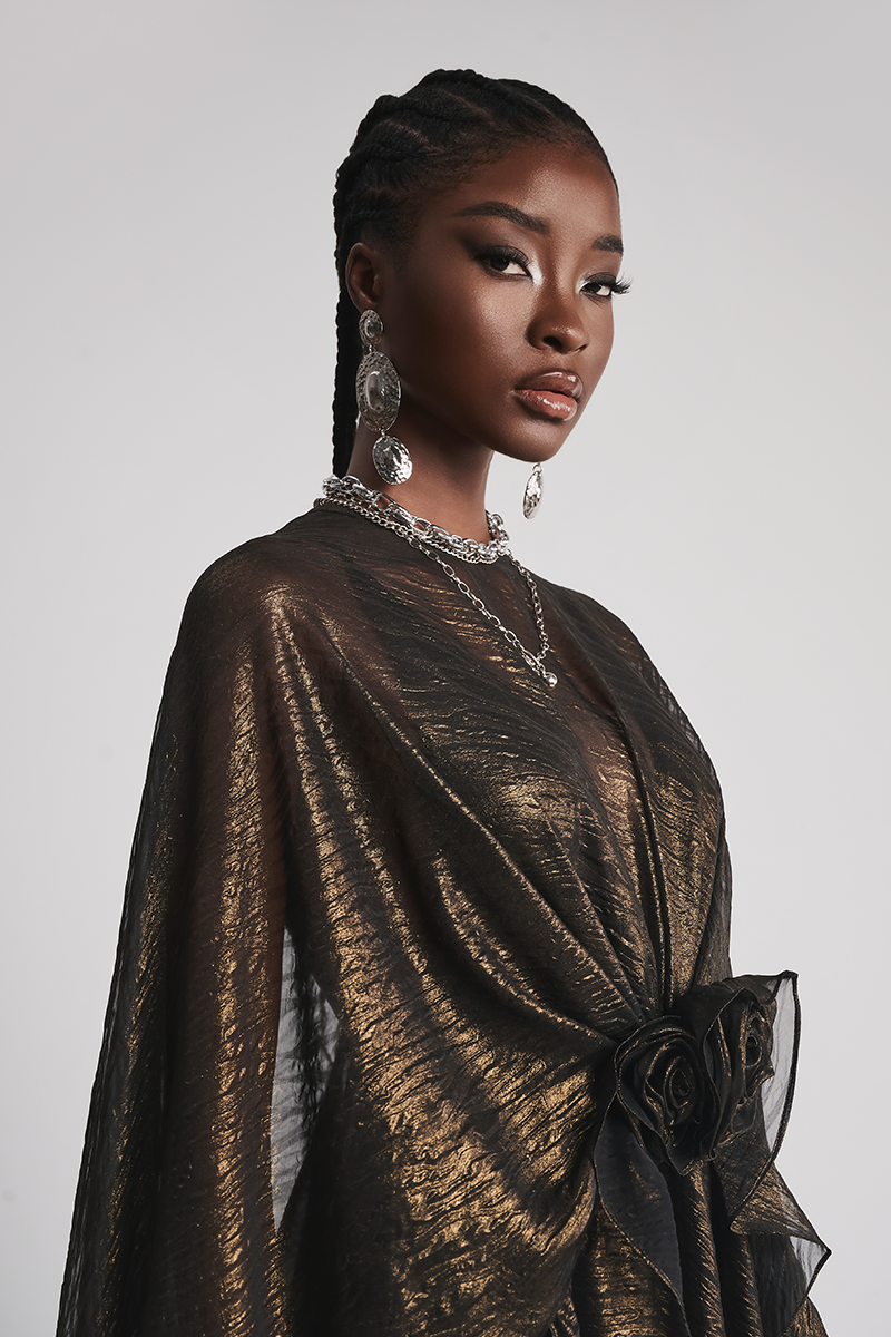 Black Rose Reverie gown by Le Thanh Hoa featuring elegant fabric and intricate design, displayed on a mannequin.