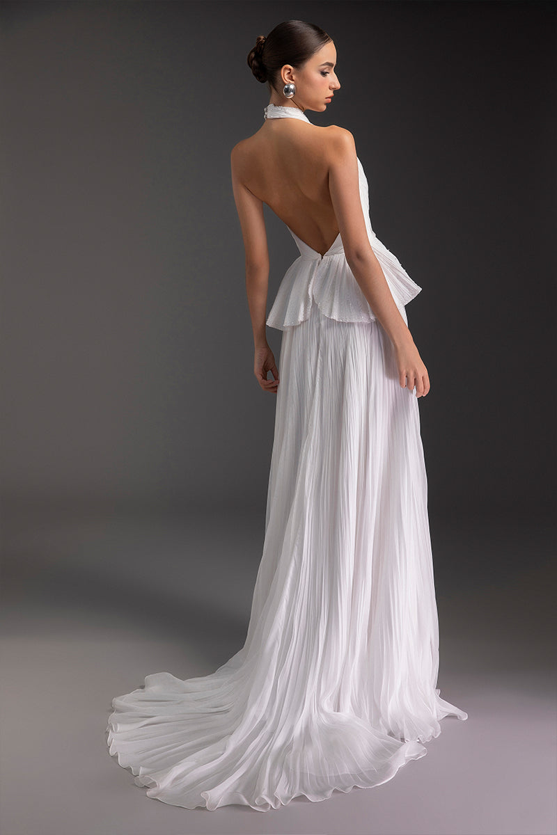 Le Thanh Hoa Snow Bloom gown featuring delicate floral embroidery and flowing fabric, perfect for elegant occasions.