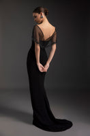 Black Dahlia gown by Le Thanh Hoa featuring elegant fabric and flowing design, perfect for formal occasions.