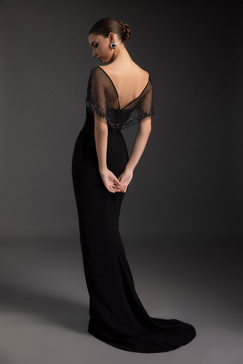 Black Dahlia gown by Le Thanh Hoa featuring elegant fabric and flowing design, perfect for formal occasions.